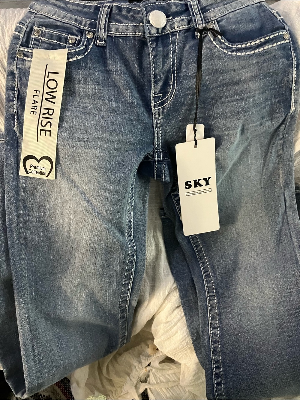 Sky Low Rise Flare Jeans in Light Blue Wash